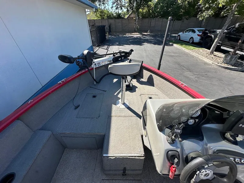 Slide: The Image of 2013 Tracker Pro Guide V-175 SC boat interior with steering console and seating. - 21