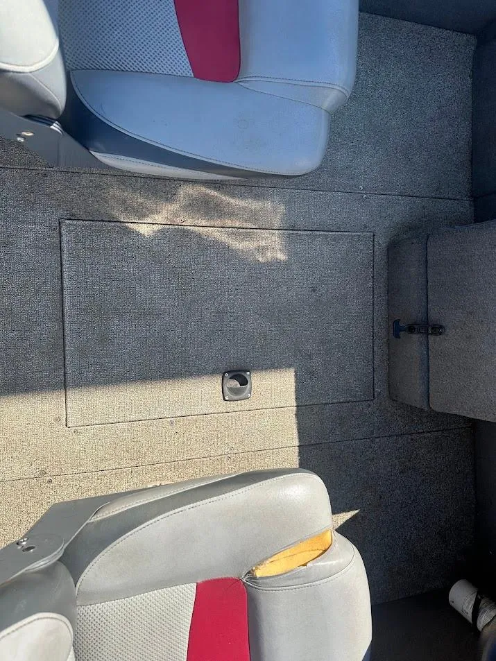 Slide: The Image of 2013 Tracker Pro Guide V-175 SC boat interior with gray and red seating. - 32