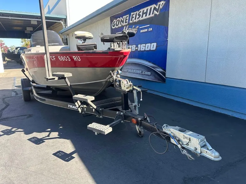 Slide: The Image of 2013 Tracker Pro Guide V-175 SC boat on trailer, parked outside a dealership. - 4