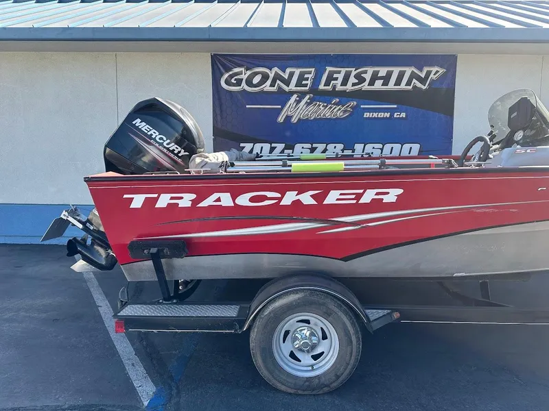 Slide: The Image of 2013 Tracker Pro Guide V-175 SC boat with Mercury engine, parked at Gone Fishin' Marine. - 7