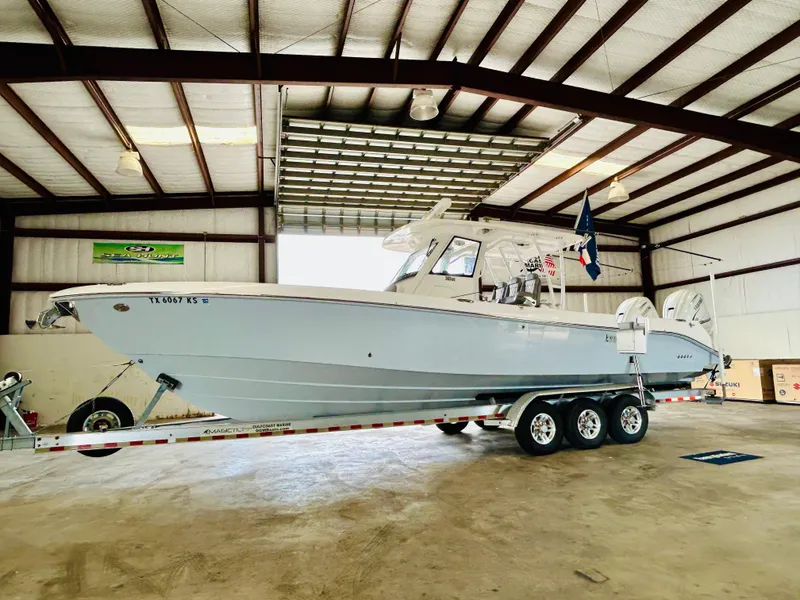 Slide: The Image of 2022 Everglades 365 Center Console boat on a trailer in a warehouse. - 5