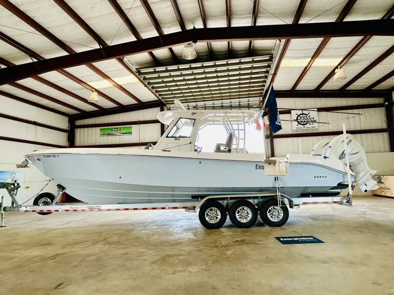 Slide: The Image of 2022 Everglades 365 Center Console boat on trailer in indoor storage facility. - 6