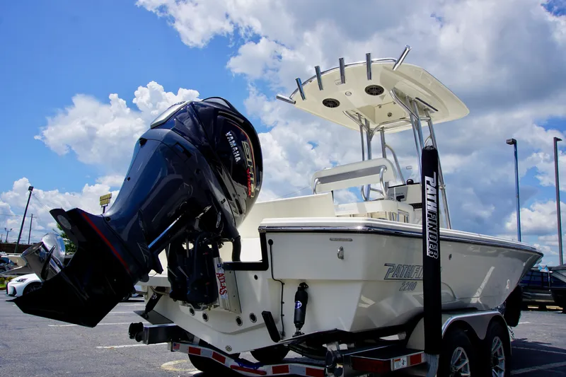 Slide: The Image of 2026 Pathfinder 2200 TRS boat with Yamaha outboard motor under a cloudy sky. - 3