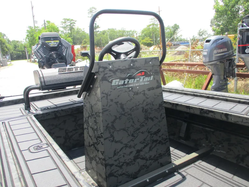 Slide: The Image of 2024 Gator Tail 1860 Extreme CC boat with steering console and outboard motors. - 10