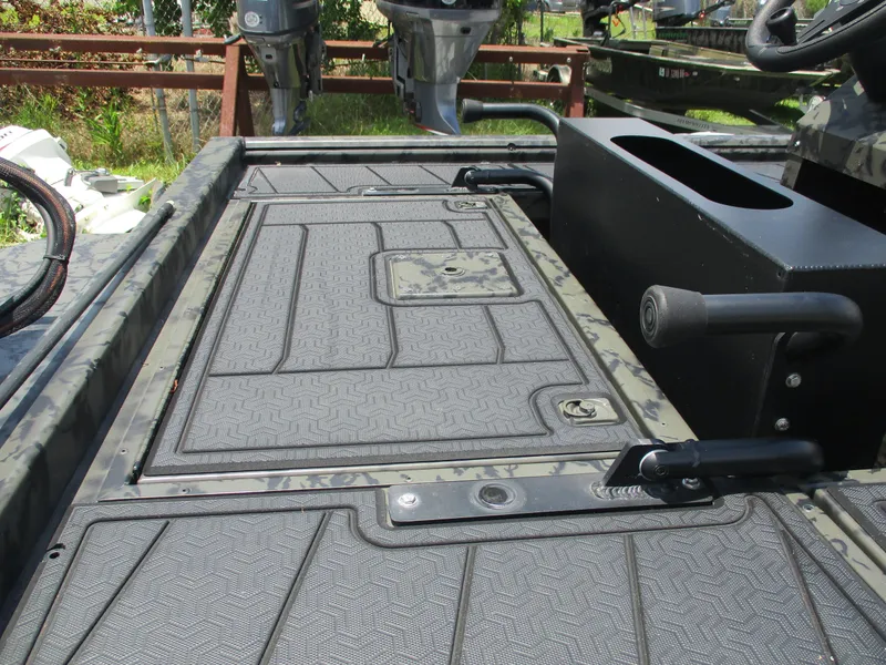 Slide: The Image of 2024 Gator Tail 1860 Extreme CC boat deck with textured surface and control console. - 12