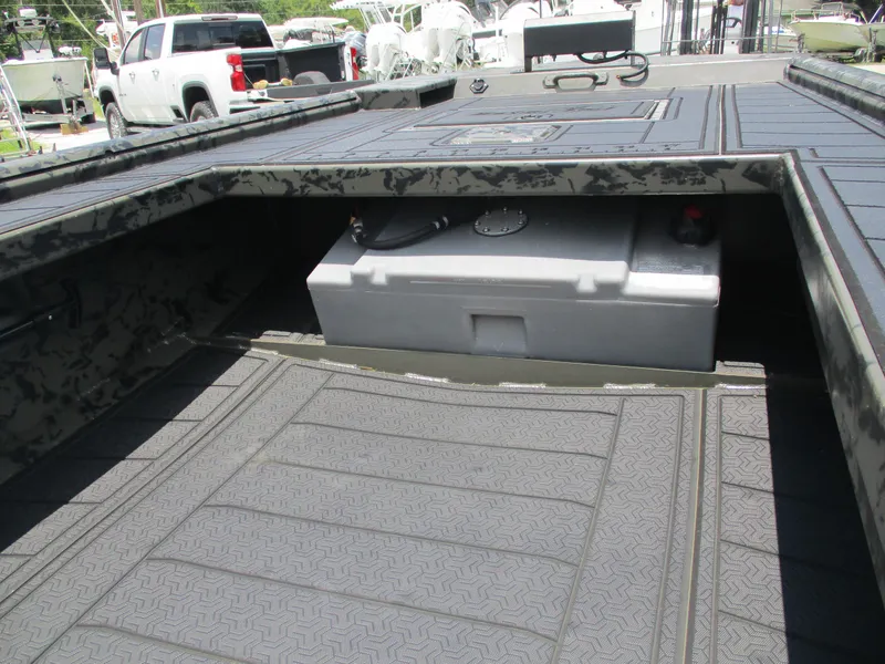 Slide: The Image of 2024 Gator Tail 1860 Extreme CC boat interior with storage compartment and textured flooring. - 13