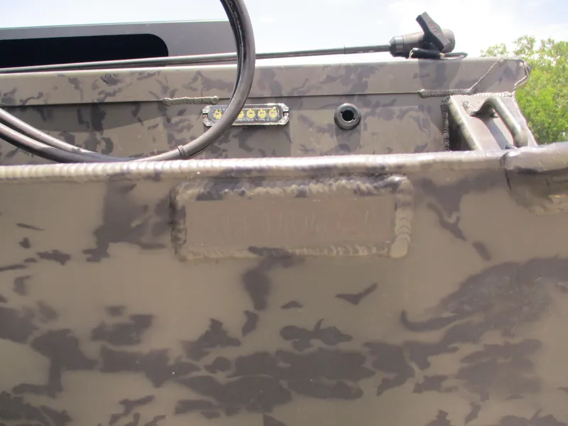 Slide: The Image of 2024 Gator Tail 1860 Extreme CC boat with camouflage pattern and LED light detail. - 14