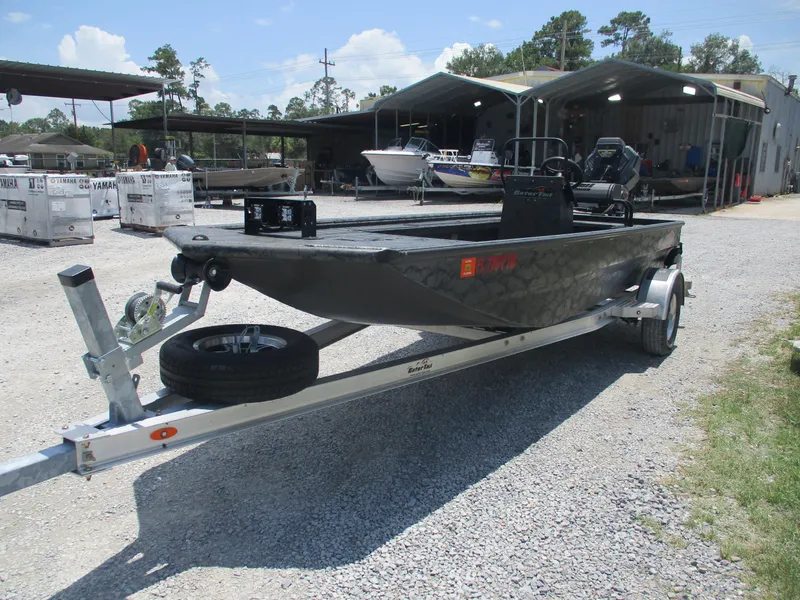 Slide: The Image of 2024 Gator Tail 1860 Extreme CC boat on trailer in outdoor storage area. - 5