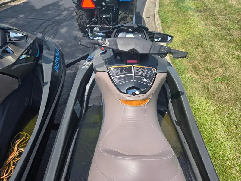 Slide: The Image of 2016 Sea-Doo GTX Limited iS 260 jet ski parked on grass. - 10