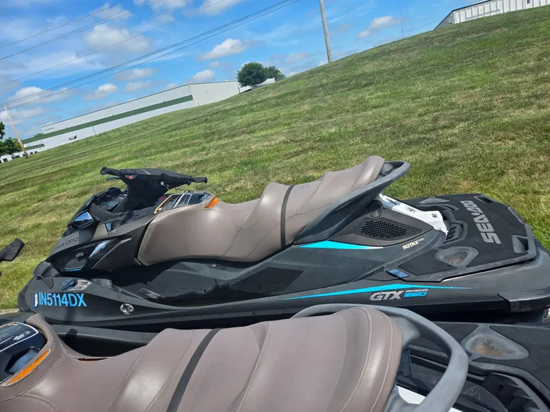 Slide: The Image of 2016 Sea-Doo GTX Limited iS 260 jet ski on grassy field under blue sky. - 4