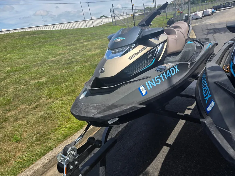 Slide: The Image of 2016 Sea-Doo GTX Limited iS 260 jet ski on trailer, parked outdoors. - 5