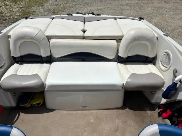 Slide: The Image of 2006 Tahoe Q4 Sport Fish boat interior with cushioned seating and storage. - 10