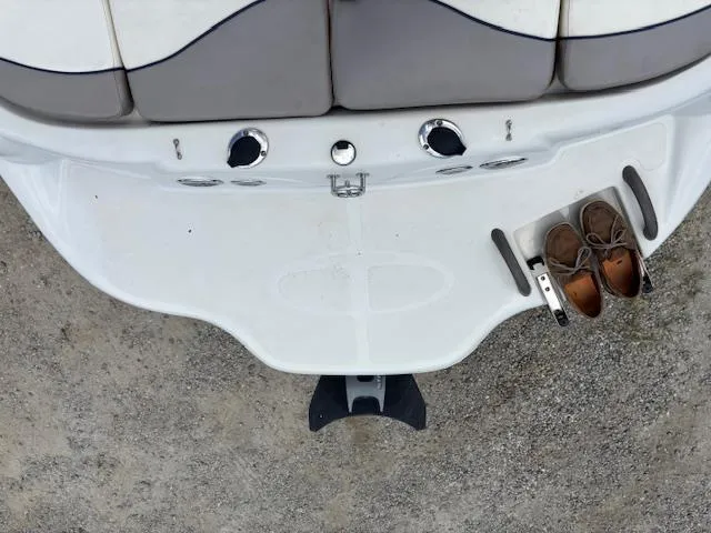 Slide: The Image of 2006 Tahoe Q4 Sport Fish boat stern with shoes on swim platform. - 17