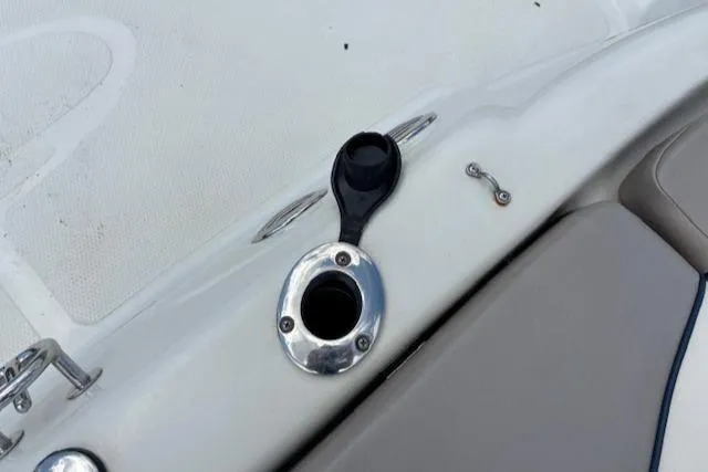 Slide: The Image of 2006 Tahoe Q4 Sport Fish boat detail showing a rod holder and seating area. - 23