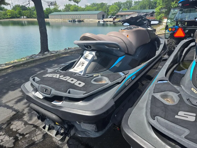 Slide: The Image of 2016 Sea-Doo GTX Limited iS 260 jet ski parked by a serene lake. - 3