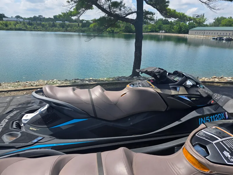 Slide: The Image of 2016 Sea-Doo GTX Limited iS 260 jet ski by a serene lake. - 4