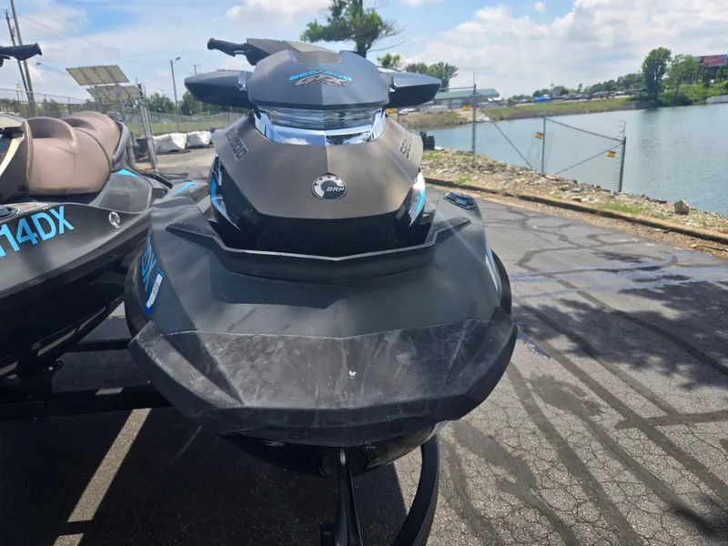 Slide: The Image of 2016 Sea-Doo GTX Limited iS 260 jet ski parked near a waterfront. - 6
