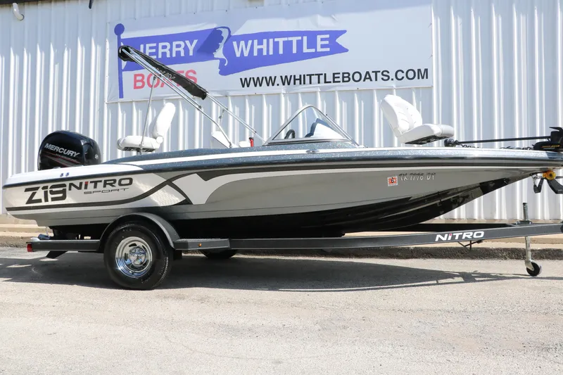 Slide: The Image of 2017 Nitro Z19 Sport boat on trailer, displayed outside Whittle Boats dealership. - 1