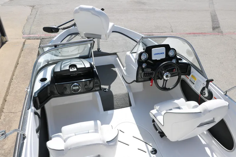 Slide: The Image of 2017 Nitro Z19 Sport boat interior with steering wheel and white seating. - 10
