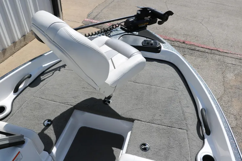 Slide: The Image of 2017 Nitro Z19 Sport boat interior with white seat and gray carpet. - 12