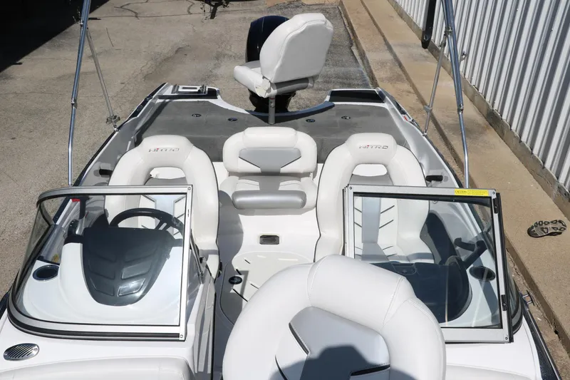 Slide: The Image of 2017 Nitro Z19 Sport boat interior with white seating and dual consoles. - 13