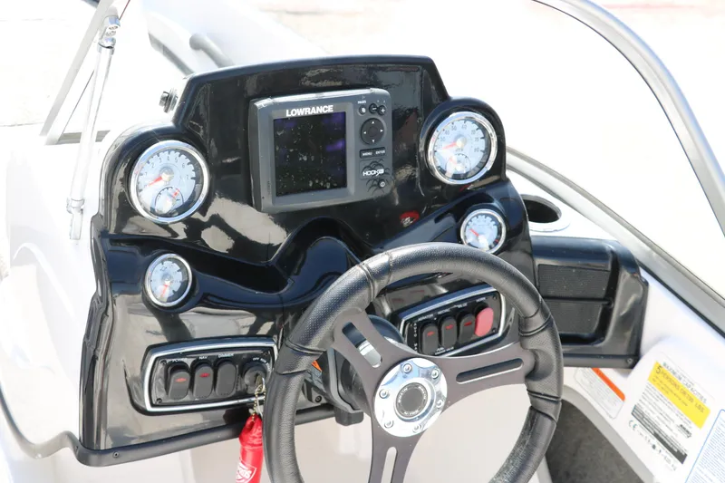 Slide: The Image of Dashboard of 2017 Nitro Z19 Sport boat with steering wheel and gauges. - 19