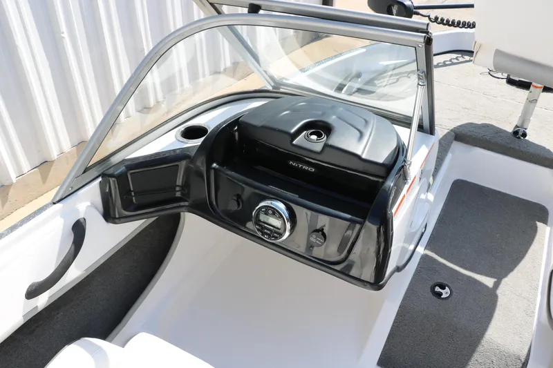 Slide: The Image of 2017 Nitro Z19 Sport boat dashboard with steering wheel and windshield. - 20