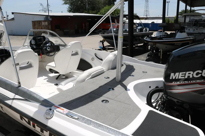 Slide: The Image of 2017 Nitro Z19 Sport boat with Mercury engine, featuring sleek interior and modern controls. - 23