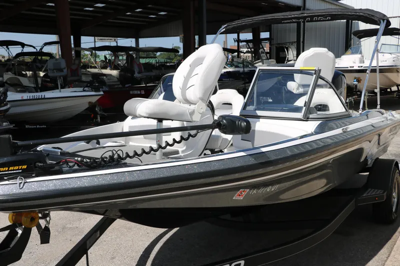 Slide: The Image of 2017 Nitro Z19 Sport boat with white seating, displayed in a showroom. - 6