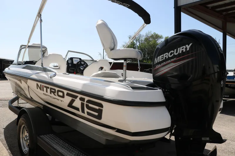 Slide: The Image of 2017 Nitro Z19 Sport boat with Mercury engine, parked on a trailer. - 7