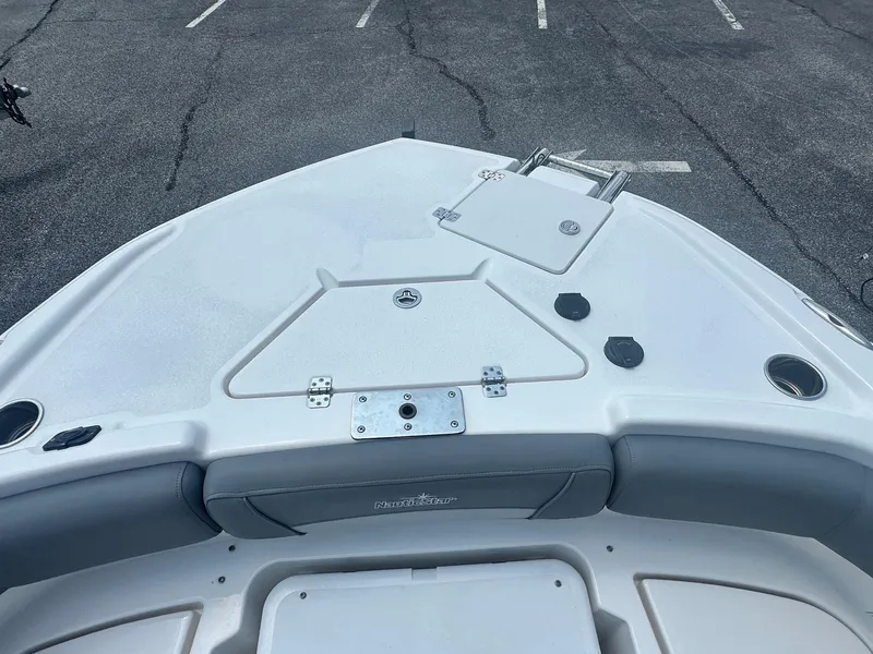 Slide: The Image of 2023 NauticStar 251 Hybrid boat interior with storage compartment. - 18