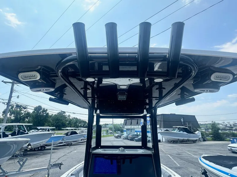 Slide: The Image of 2023 NauticStar 251 Hybrid boat interior with gray seating and console. - 20