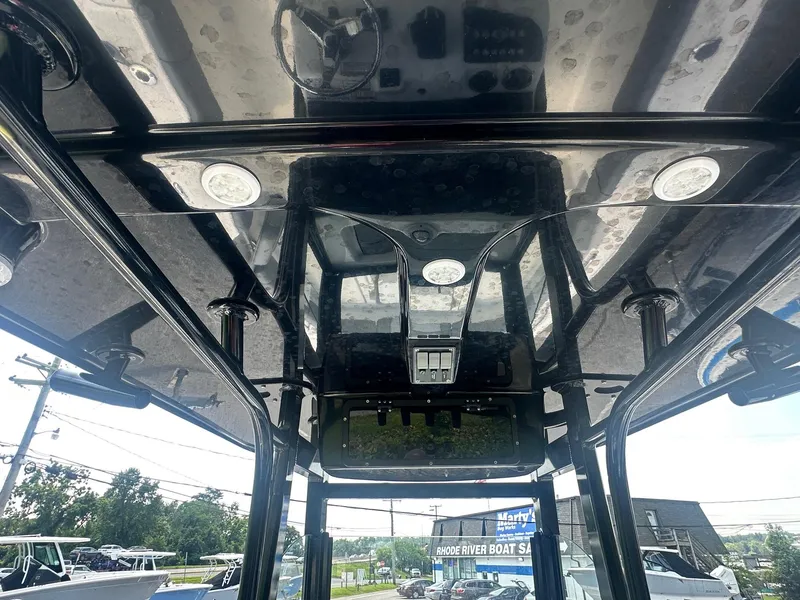 Slide: The Image of 2023 NauticStar 251 Hybrid boat interior with open storage compartment. - 21