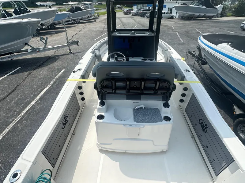 Slide: The Image of 2023 NauticStar 251 Hybrid boat interior roof with lights and controls. - 26
