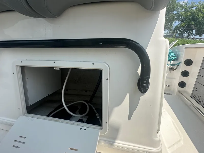 Slide: The Image of 2023 NauticStar 251 Hybrid boat with Yamaha 300 V6 engine at sunset marina. - 7