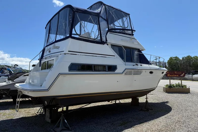 Slide: The Image of 1995 Carver 325 Aft Cabin boat on stands at Silver Sands Marina. - 19