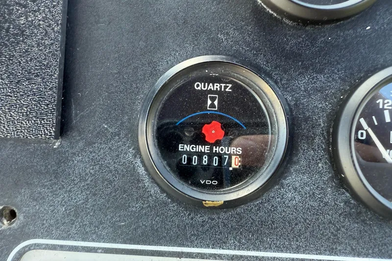 Slide: The Image of Engine hour meter showing 807 hours on a 1995 Carver 325 Aft Cabin. - 26