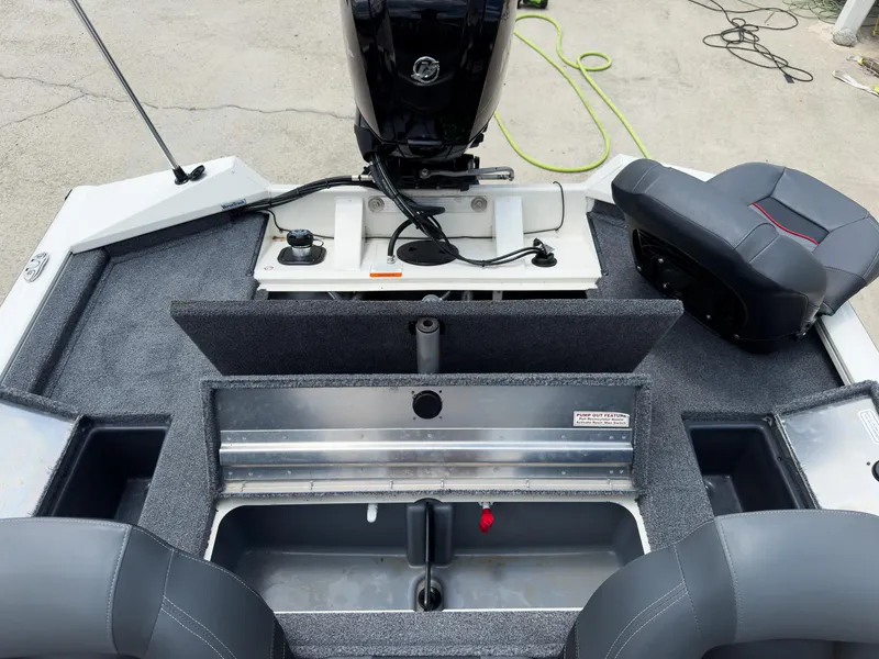 Slide: The Image of 2024 Tracker Pro Team 175 TXW boat interior with open storage compartments. - 17