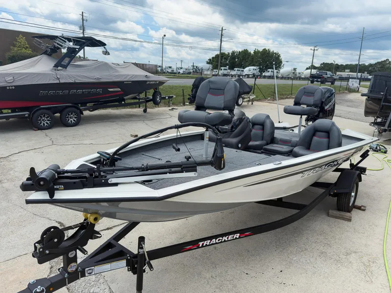 Slide: The Image of 2024 Tracker Pro Team 175 TXW fishing boat on trailer, parked outdoors. - 2