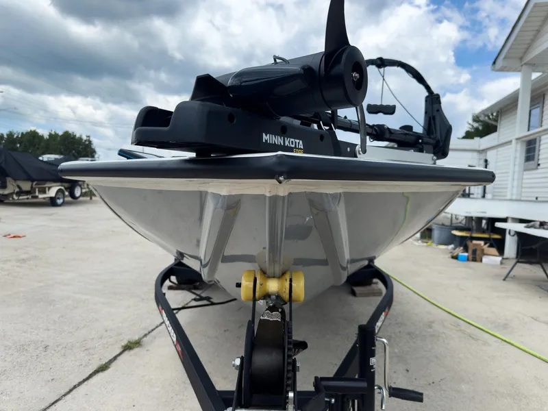 Slide: The Image of 2024 Tracker Pro Team 175 TXW boat with Minn Kota trolling motor on trailer. - 21