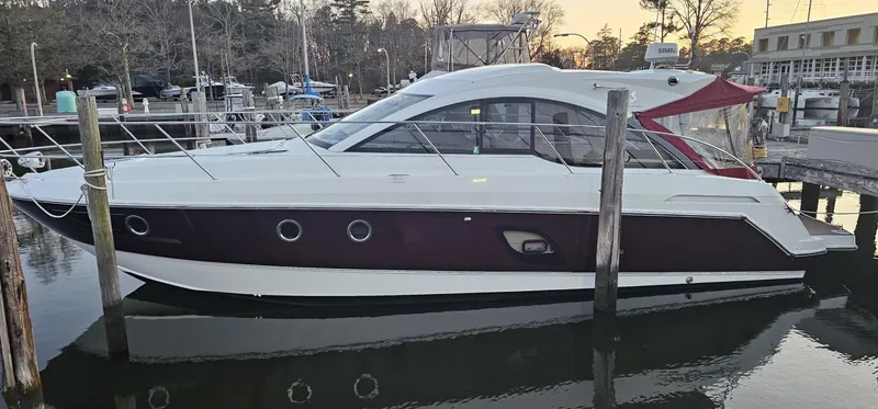 Slide: The Image of 2015 Beneteau 38 Gran Tourismo yacht docked at marina during sunset. - 3