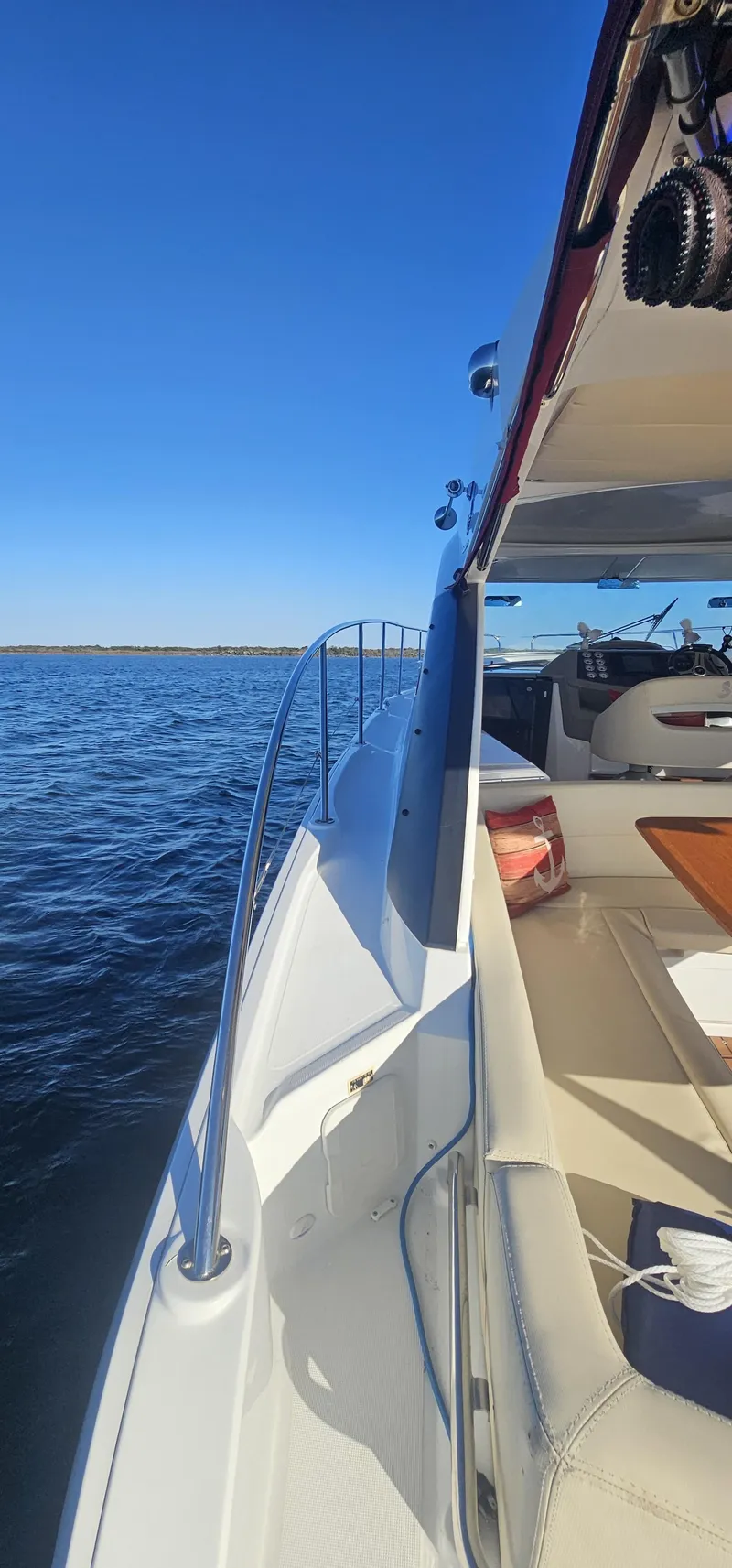 Slide: The Image of 2015 Beneteau 38 Gran Tourismo yacht cruising on open water under clear blue sky. - 13