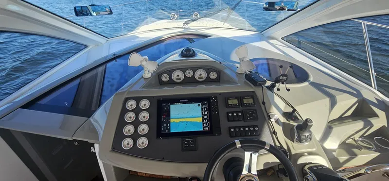 Slide: The Image of Cockpit view of 2015 Beneteau 38 Gran Tourismo yacht with navigation controls. - 8