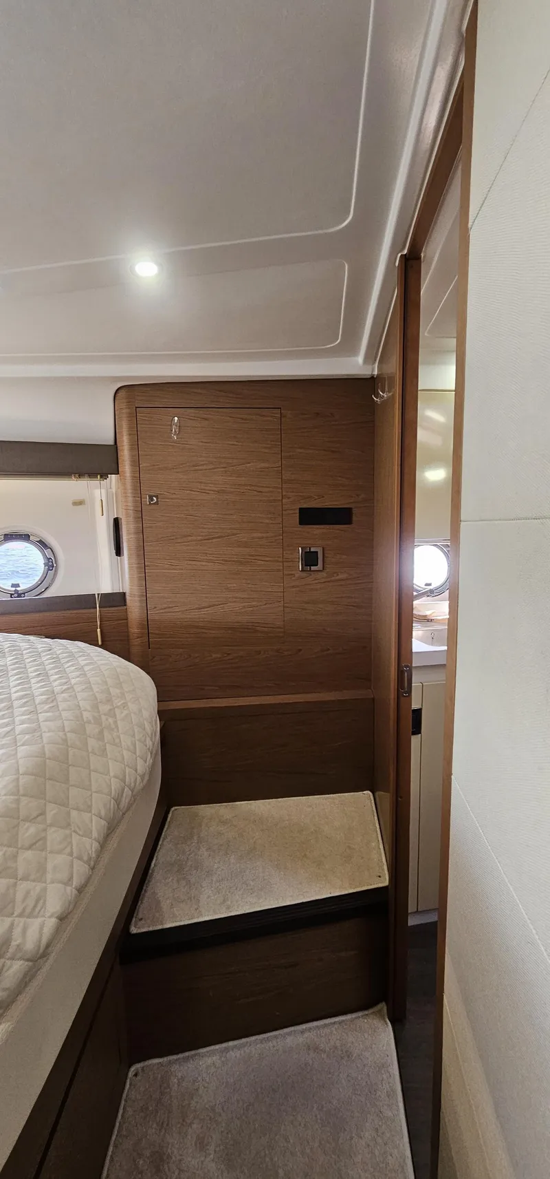 Slide: The Image of Interior of 2015 Beneteau 38 Gran Tourismo yacht, featuring cozy cabin and wooden finishes. - 23