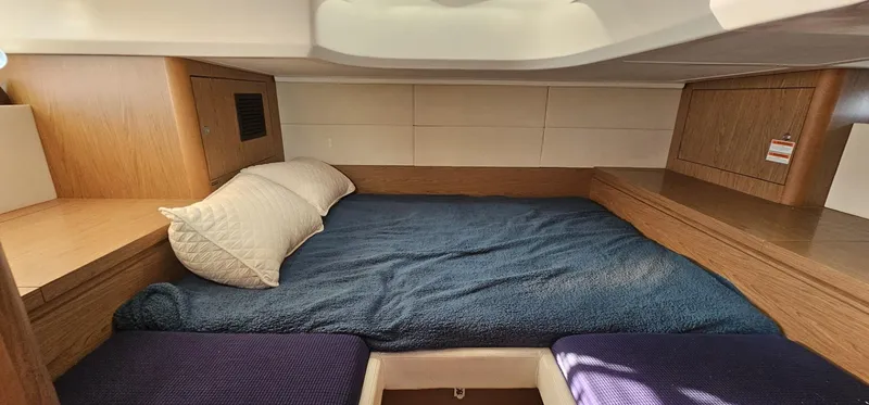 Slide: The Image of Cozy cabin interior of 2015 Beneteau 38 Gran Tourismo with comfortable bedding. - 24