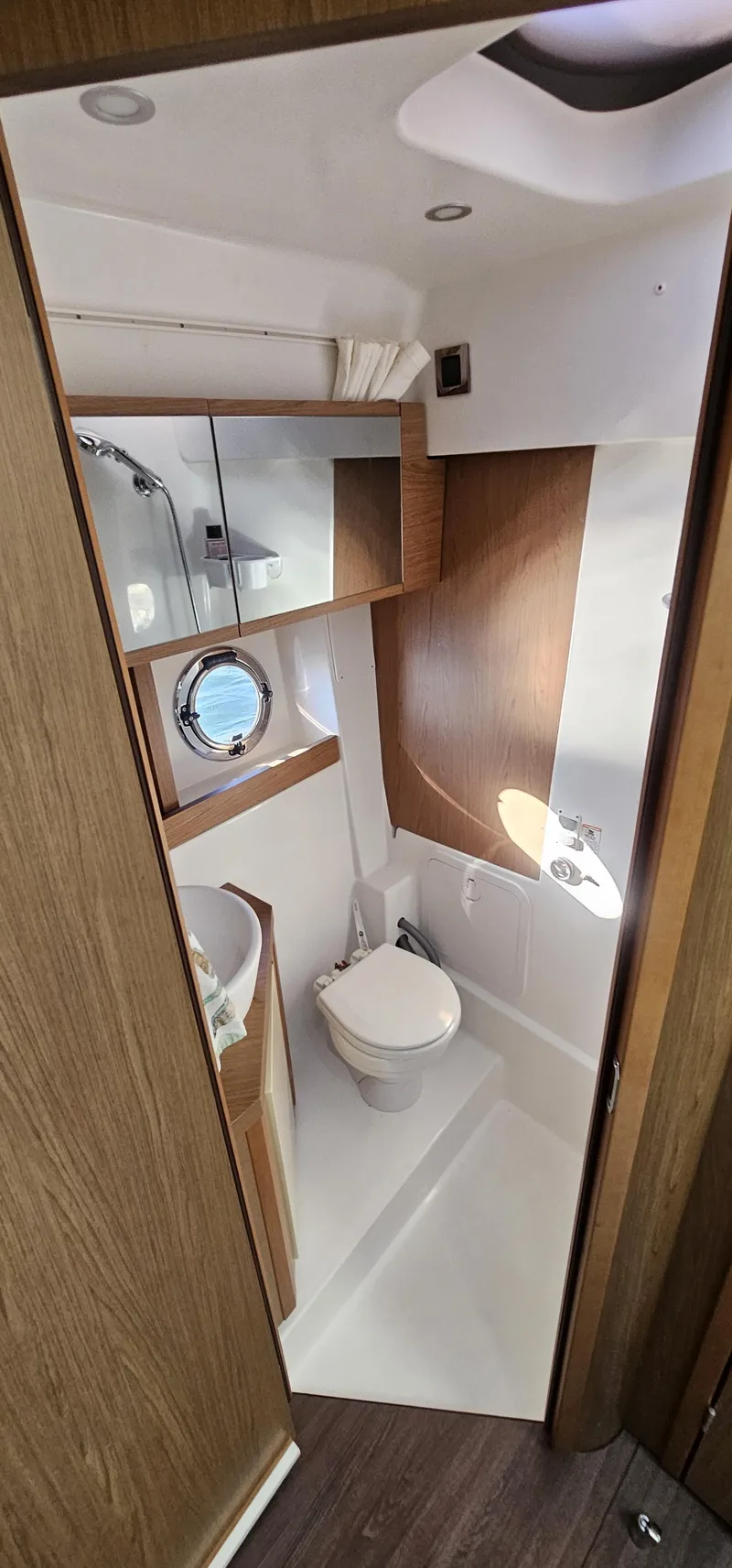 Slide: The Image of 2015 Beneteau 38 Gran Tourismo bathroom with modern fixtures and wooden accents. - 19