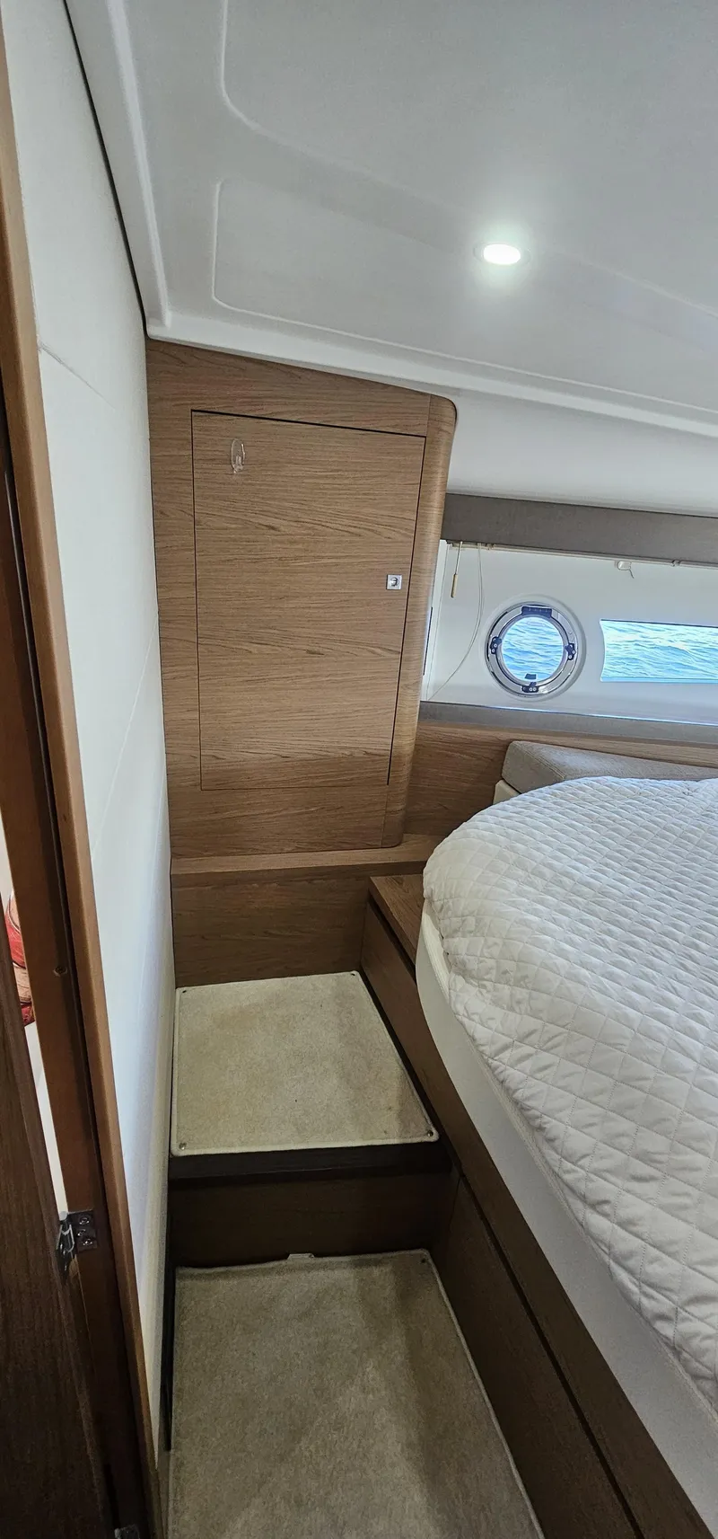 Slide: The Image of Interior of 2015 Beneteau 38 Gran Tourismo yacht with cozy bed and wooden accents. - 22