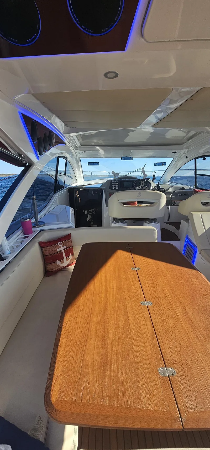 Slide: The Image of Interior of 2015 Beneteau 38 Gran Tourismo yacht with wooden table and modern seating. - 6