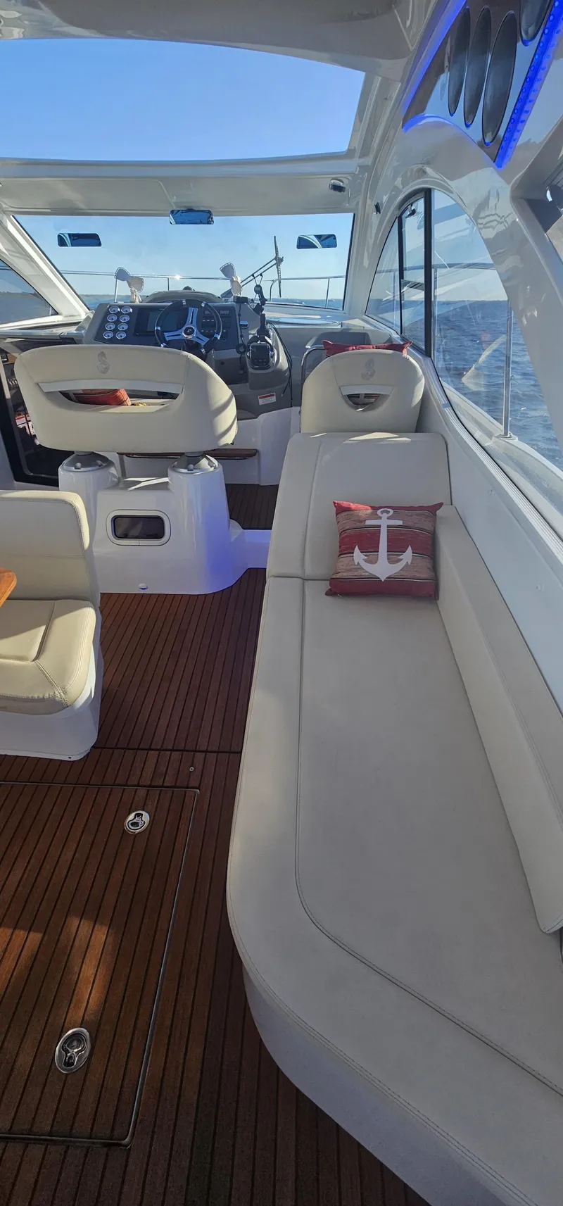 Slide: The Image of Interior of 2015 Beneteau 38 Gran Tourismo yacht with elegant seating and wooden flooring. - 11