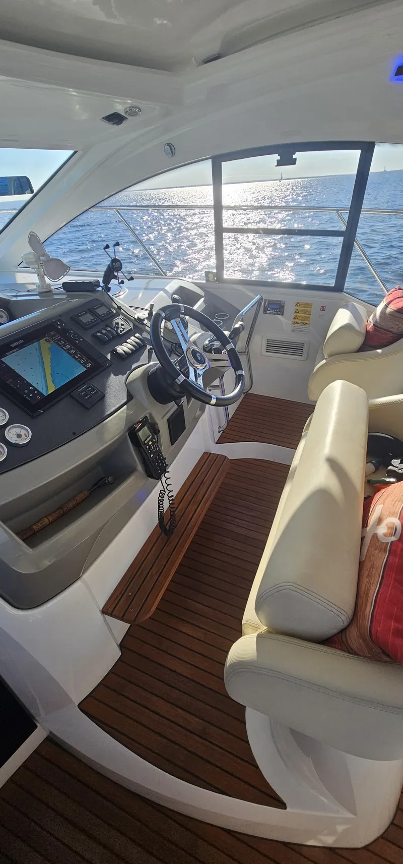 Slide: The Image of Interior of 2015 Beneteau 38 Gran Tourismo yacht with modern helm and ocean view. - 7